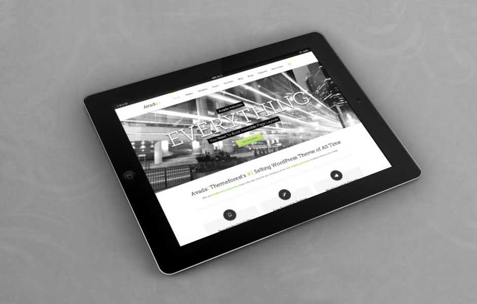 Tablet displaying a website on a table.