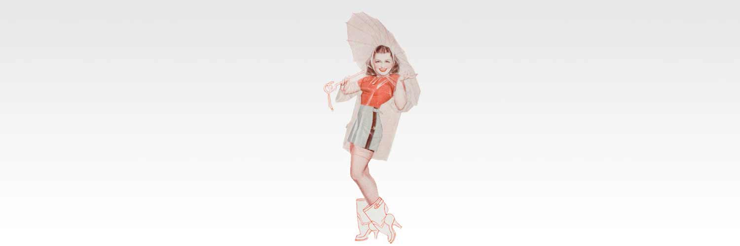 Person posing with parasol, wearing stylish outfit.