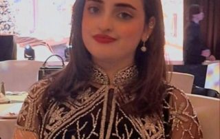Woman in beaded black dress at reception