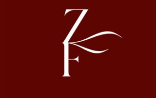 White KF monogram on maroon background
